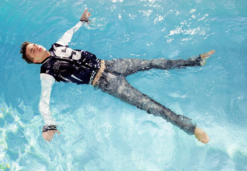 Man Floating in Pool