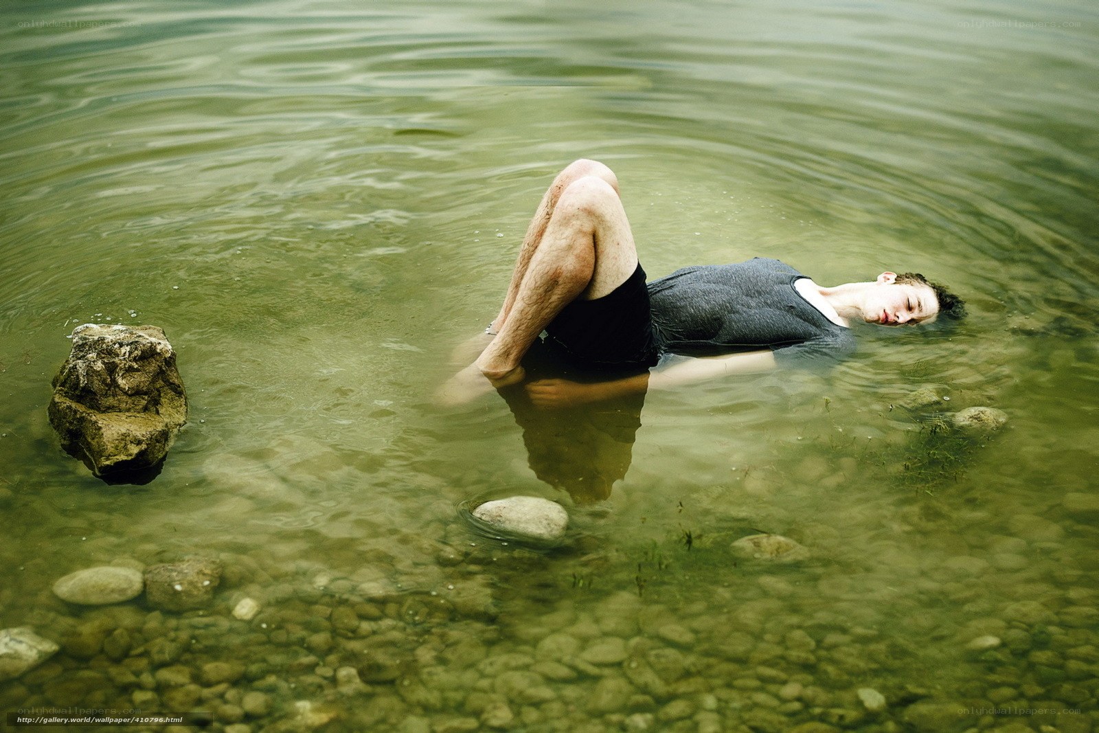 man floating in river