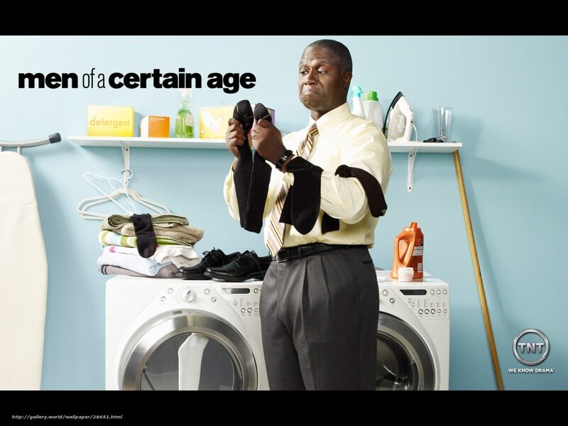 man folding laundry