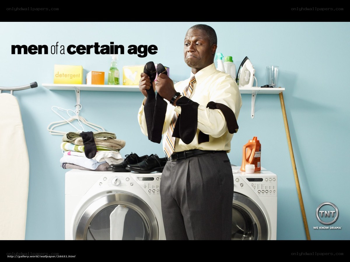 man folding laundry