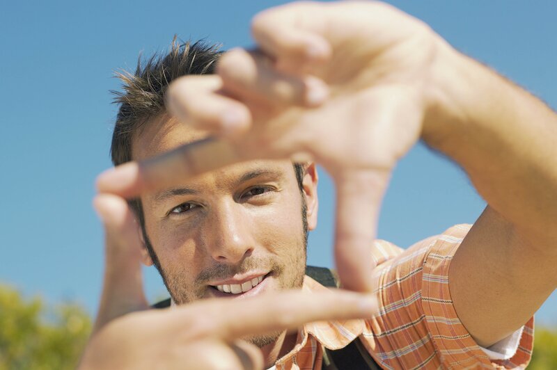 man framing face with hands