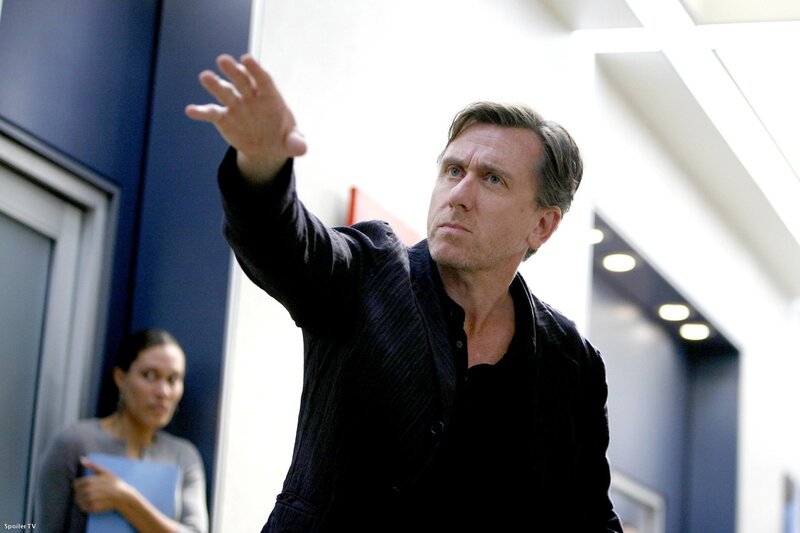 Man gesturing in hallway