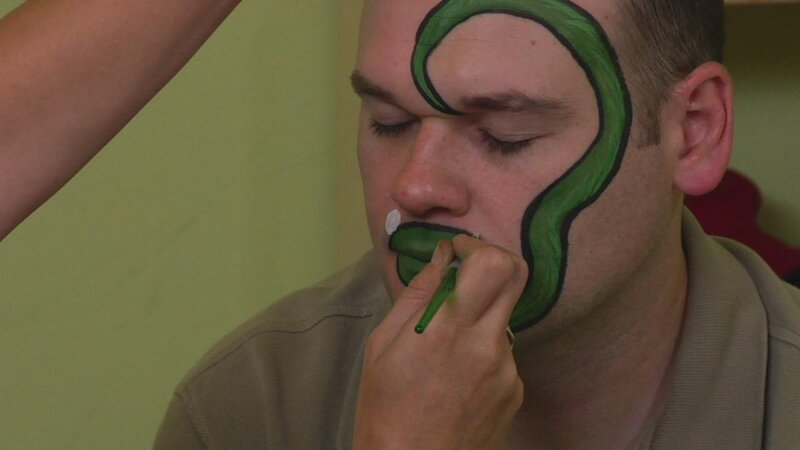 man getting face paint