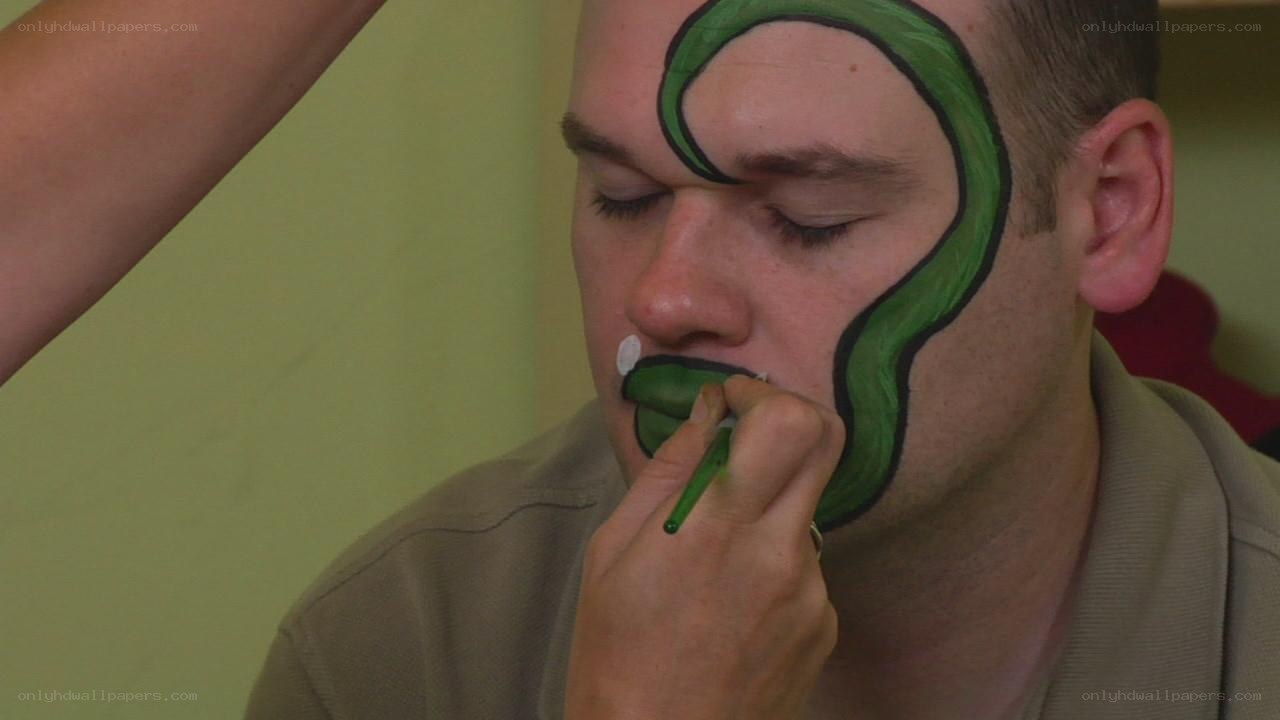 man getting face paint