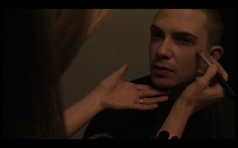 man getting makeup applied