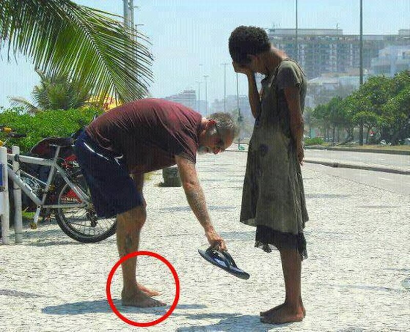 Man Giving Sandal to Child