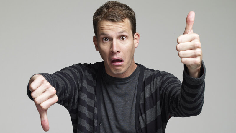 man giving thumbs up and down