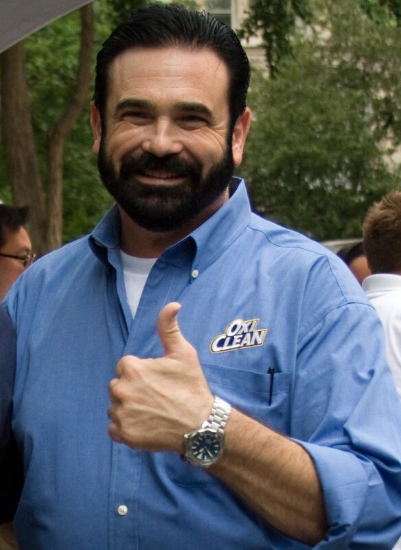 man giving thumbs up in blue shirt