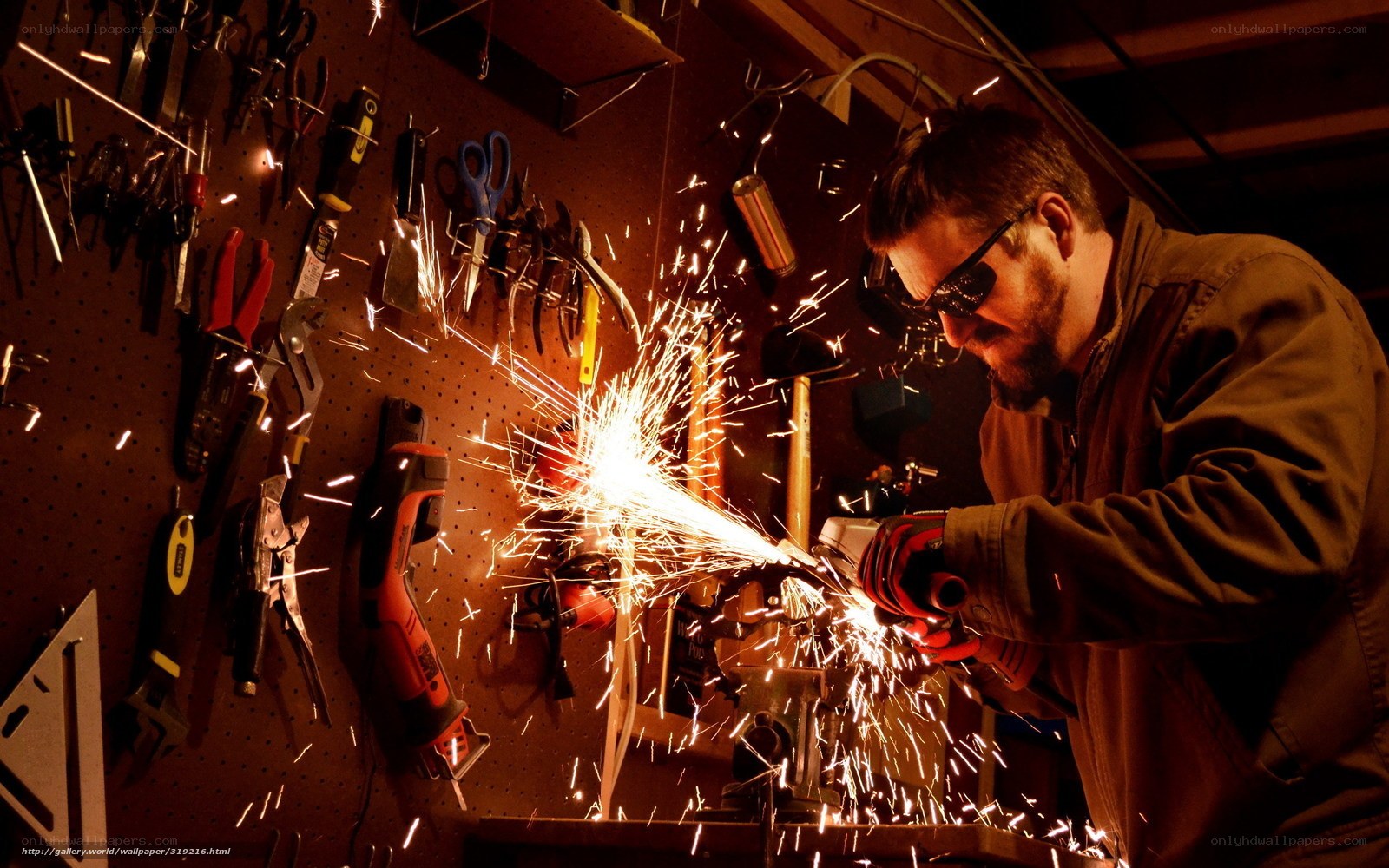 Man grinding metal with sparks