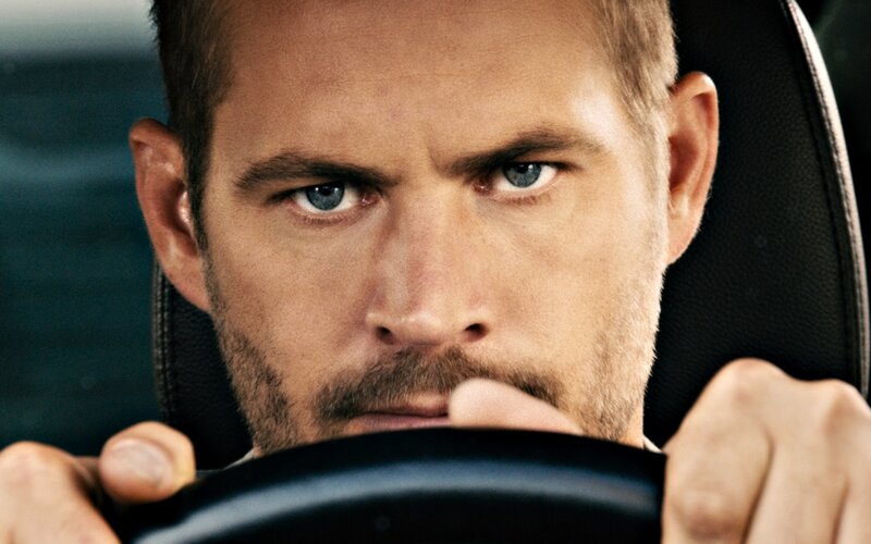 Man Gripping Steering Wheel