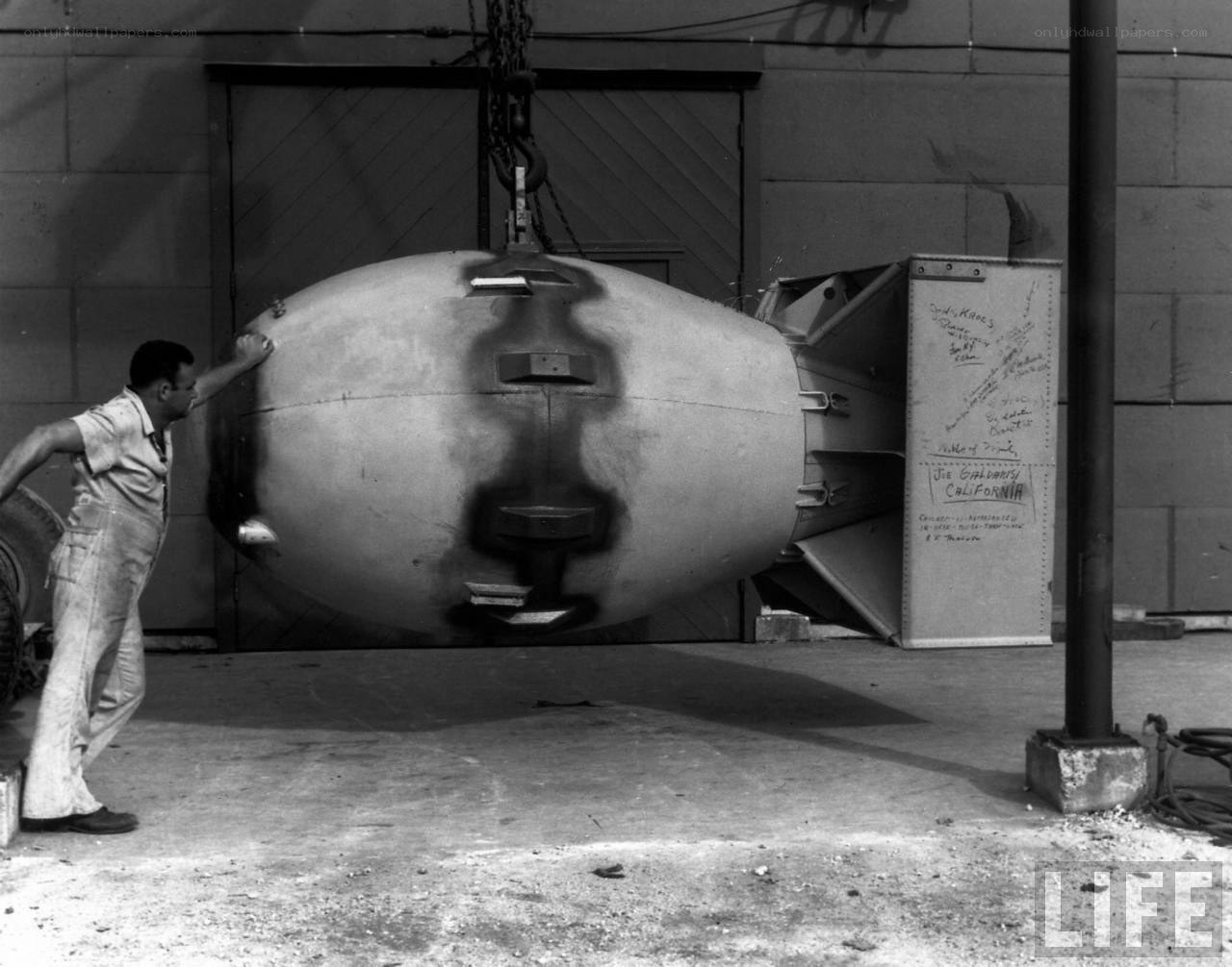 Man guiding a large bomb