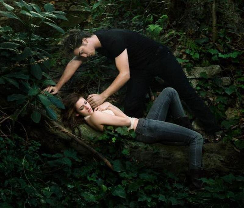 Man helping woman in forest