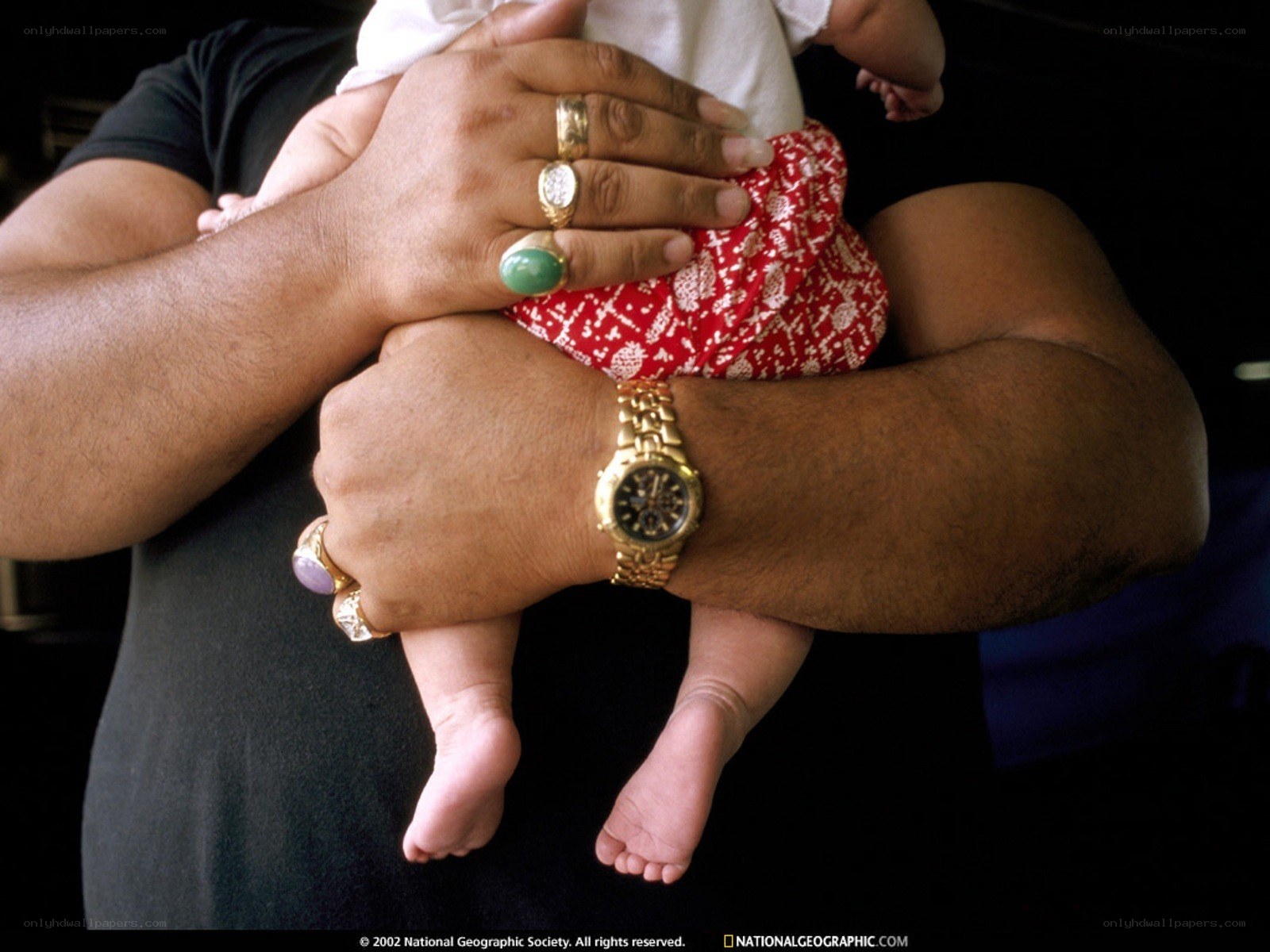 man holding a baby