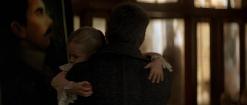 man holding a child in his arms