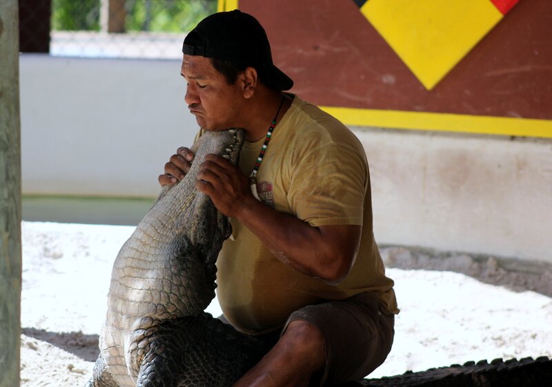Man holding a crocodile