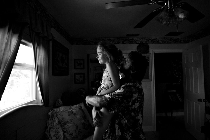 Man Holding a Girl