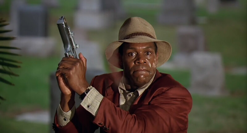 Man Holding a Gun — Brown, Tense, Night
