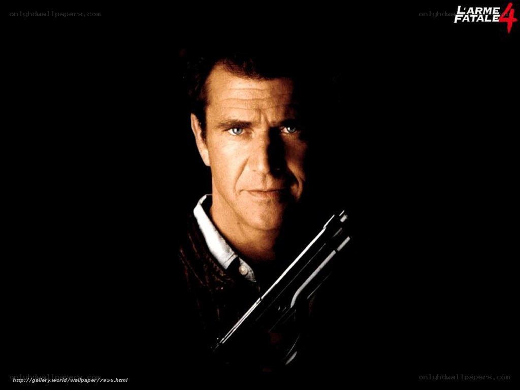 Man holding a gun in dark