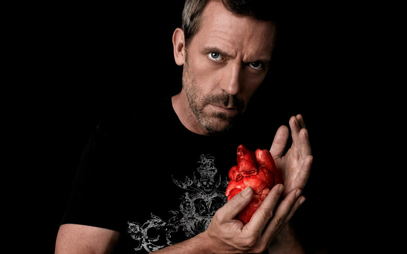 man holding a heart model