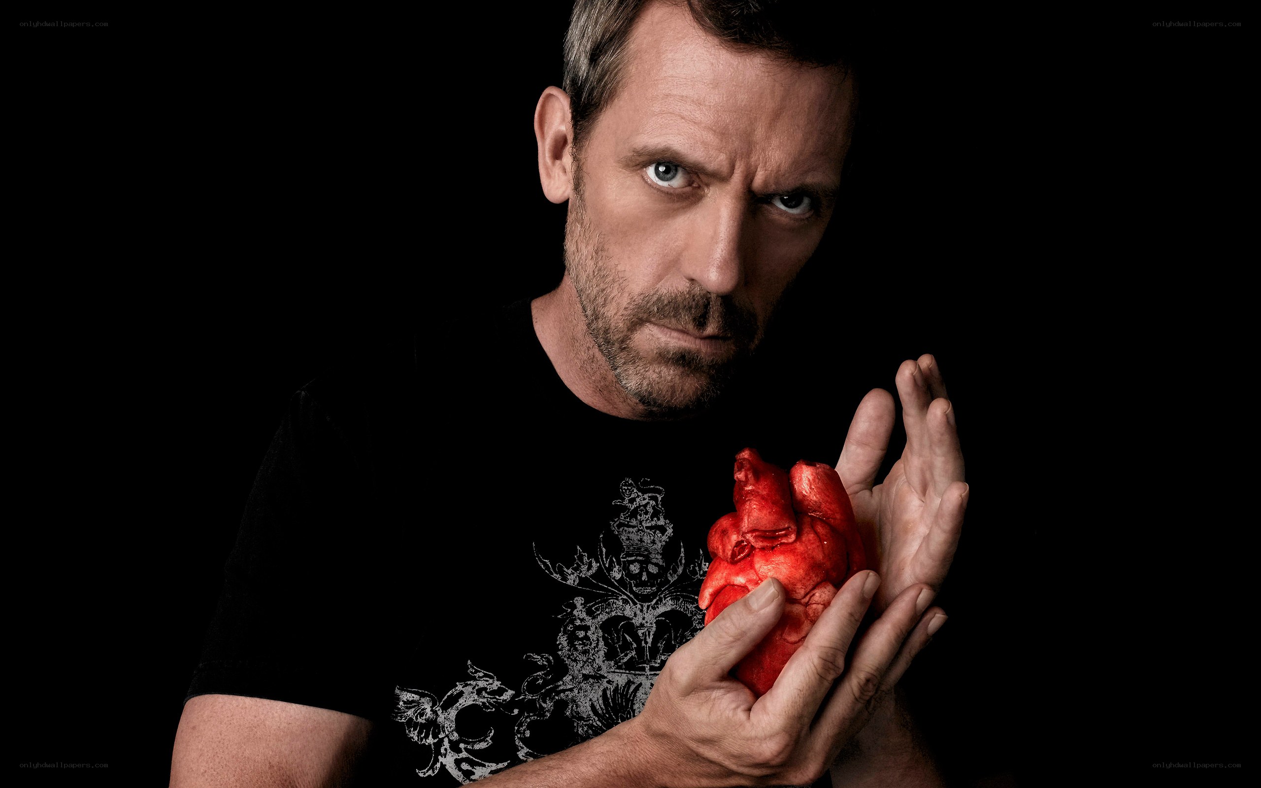man holding a heart model