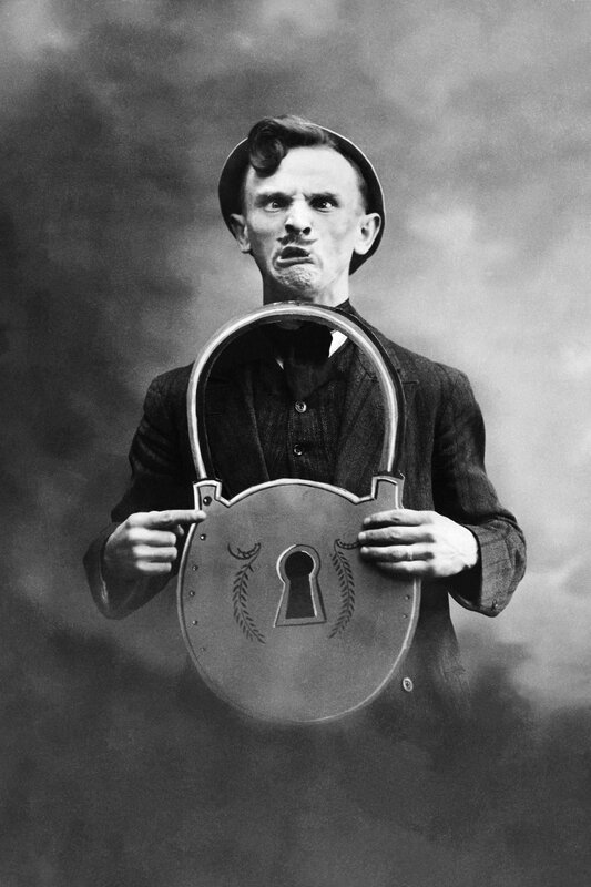 Man holding a large padlock