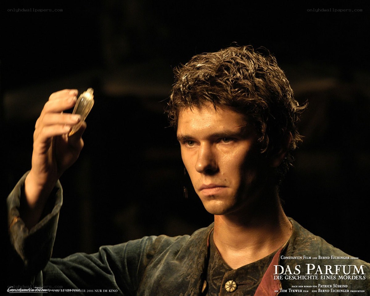 man holding a perfume bottle