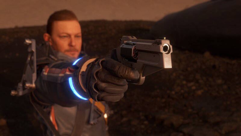 Man Holding a Pistol — Brown, Tense, Sunset