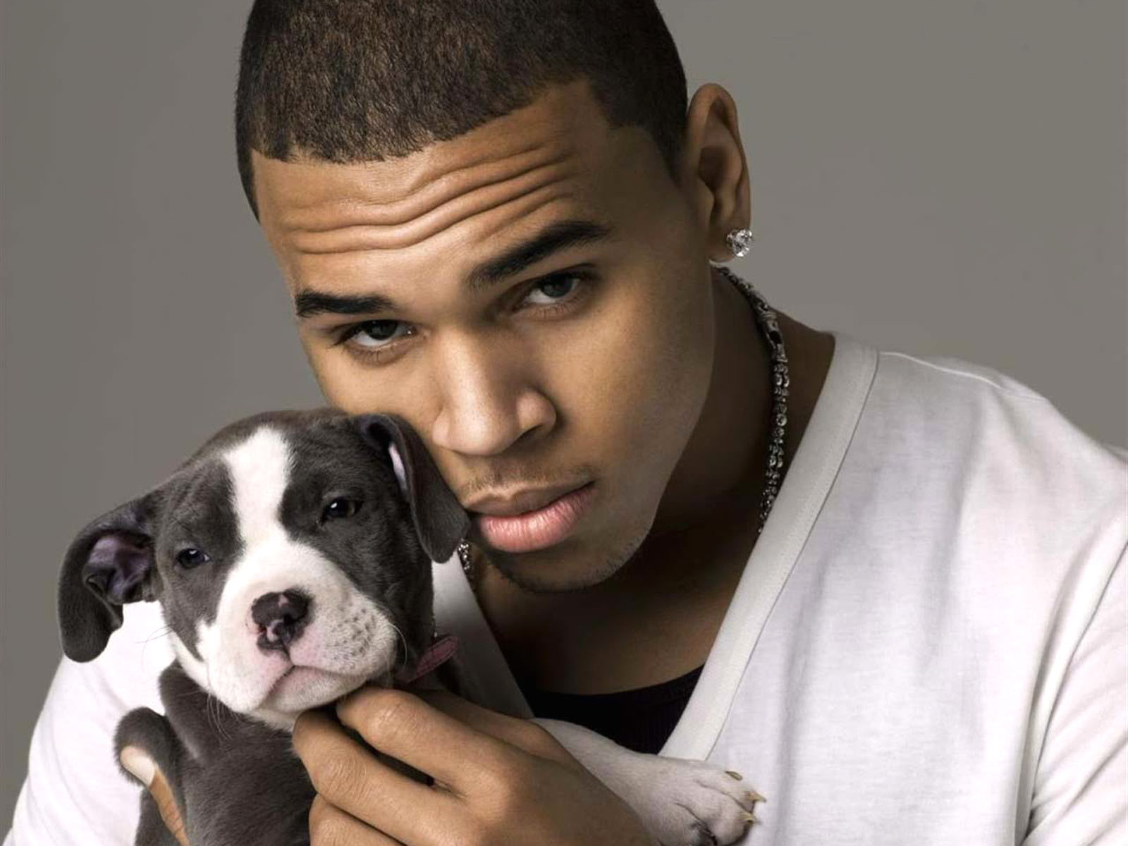 man holding a puppy