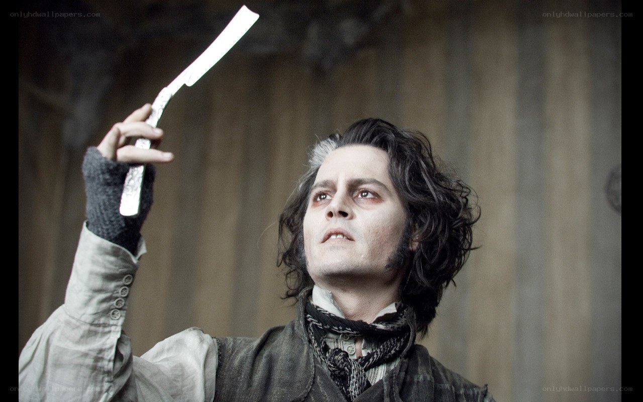 man holding a razor blade