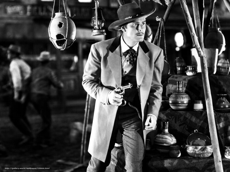 Man holding a revolver in a saloon