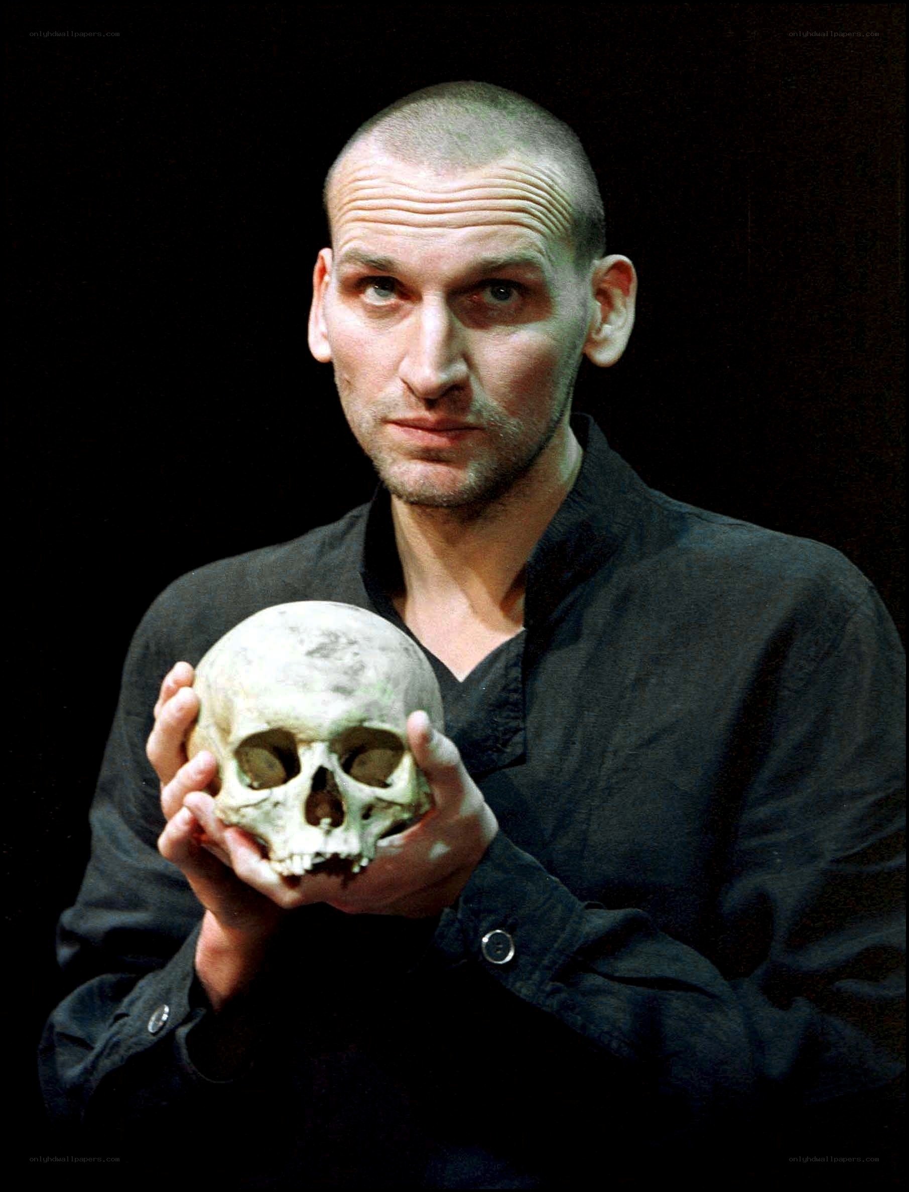 man holding a skull
