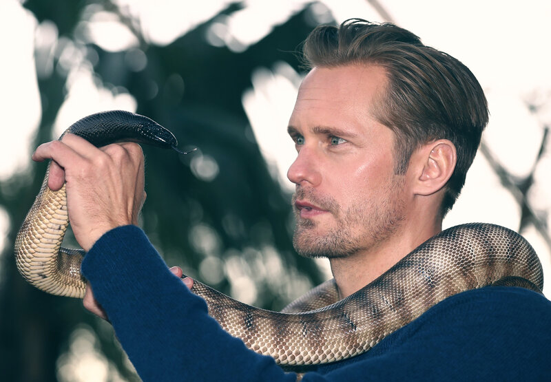 man holding a snake