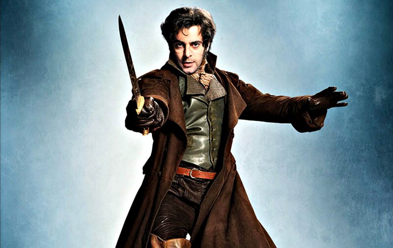 Man Holding a Sword — Brown, Dramatic, Photograph, Coat
