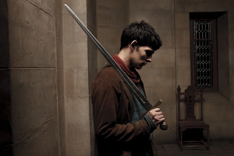 Man Holding a Sword — Brown, Dramatic, Photograph