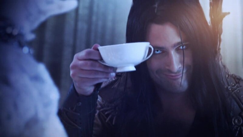 man holding a teacup