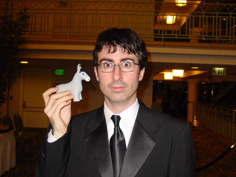 Man holding a toy donkey