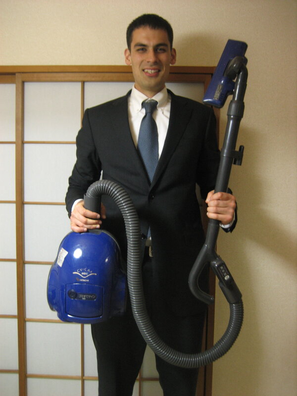 Man holding a vacuum cleaner