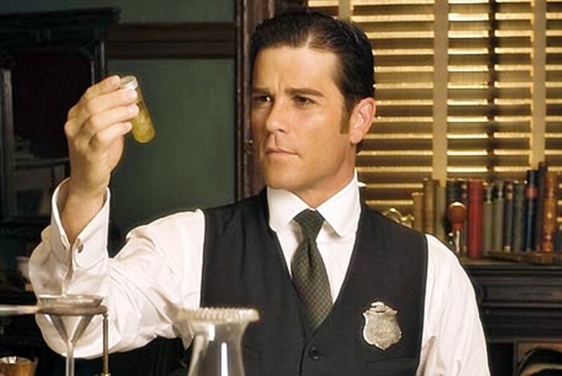 man holding a vial