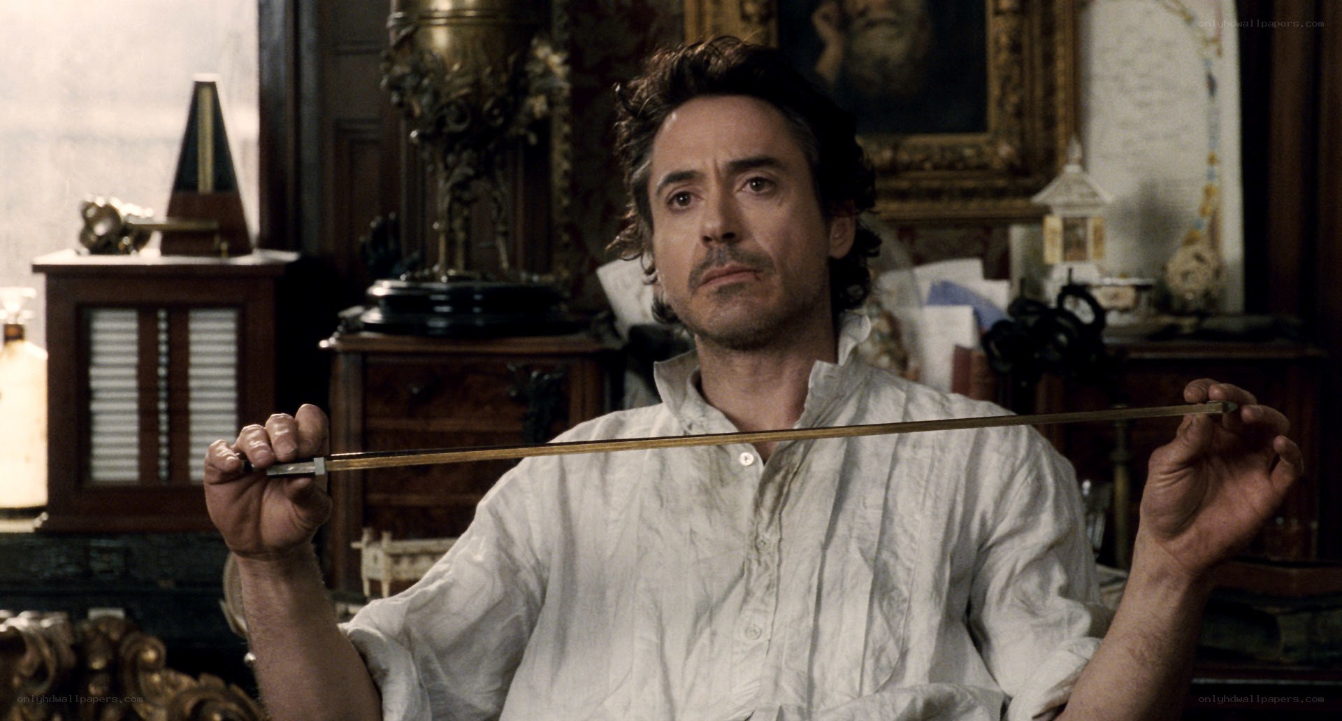 man holding a violin bow