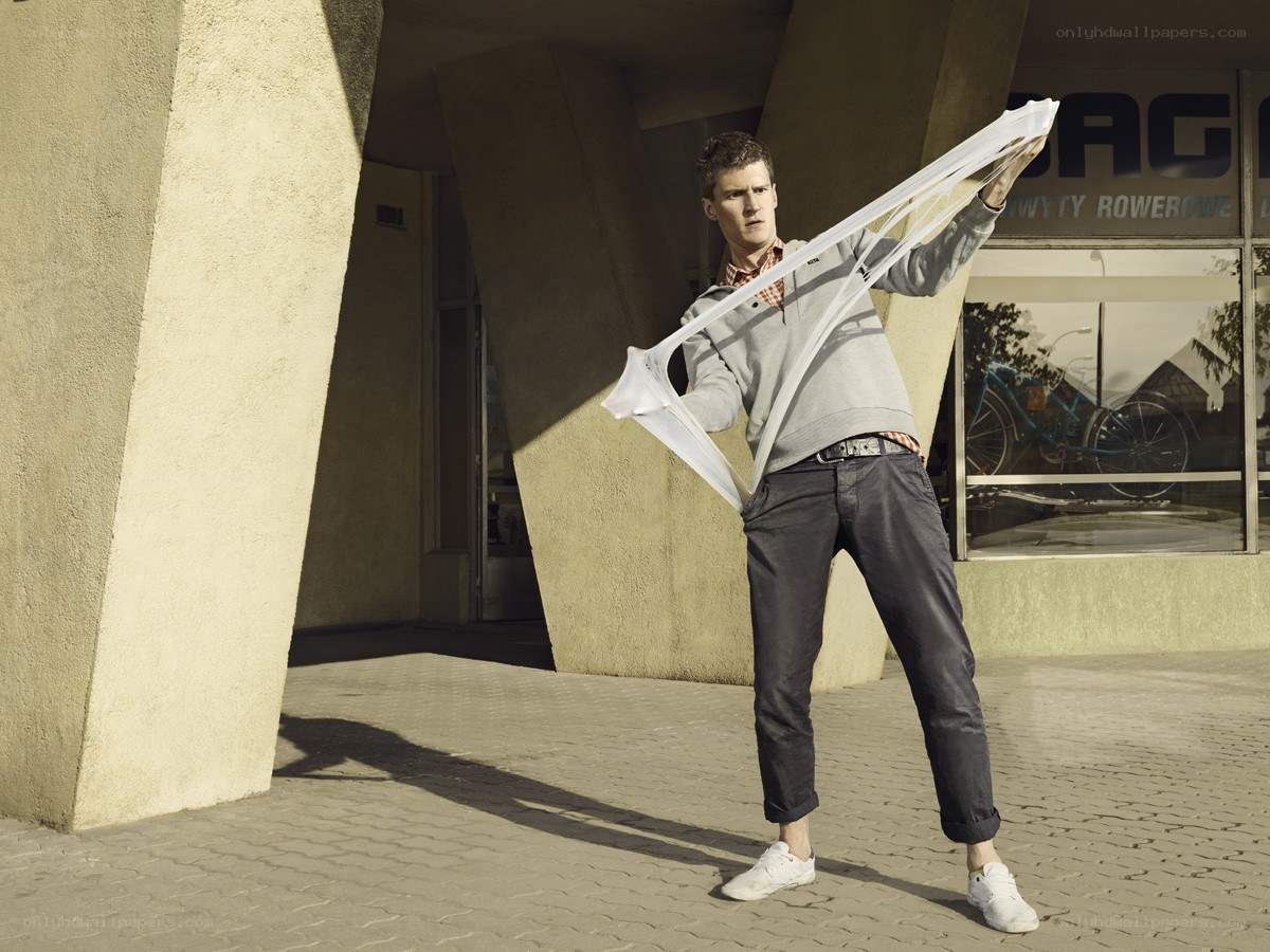 Man holding a white scarf
