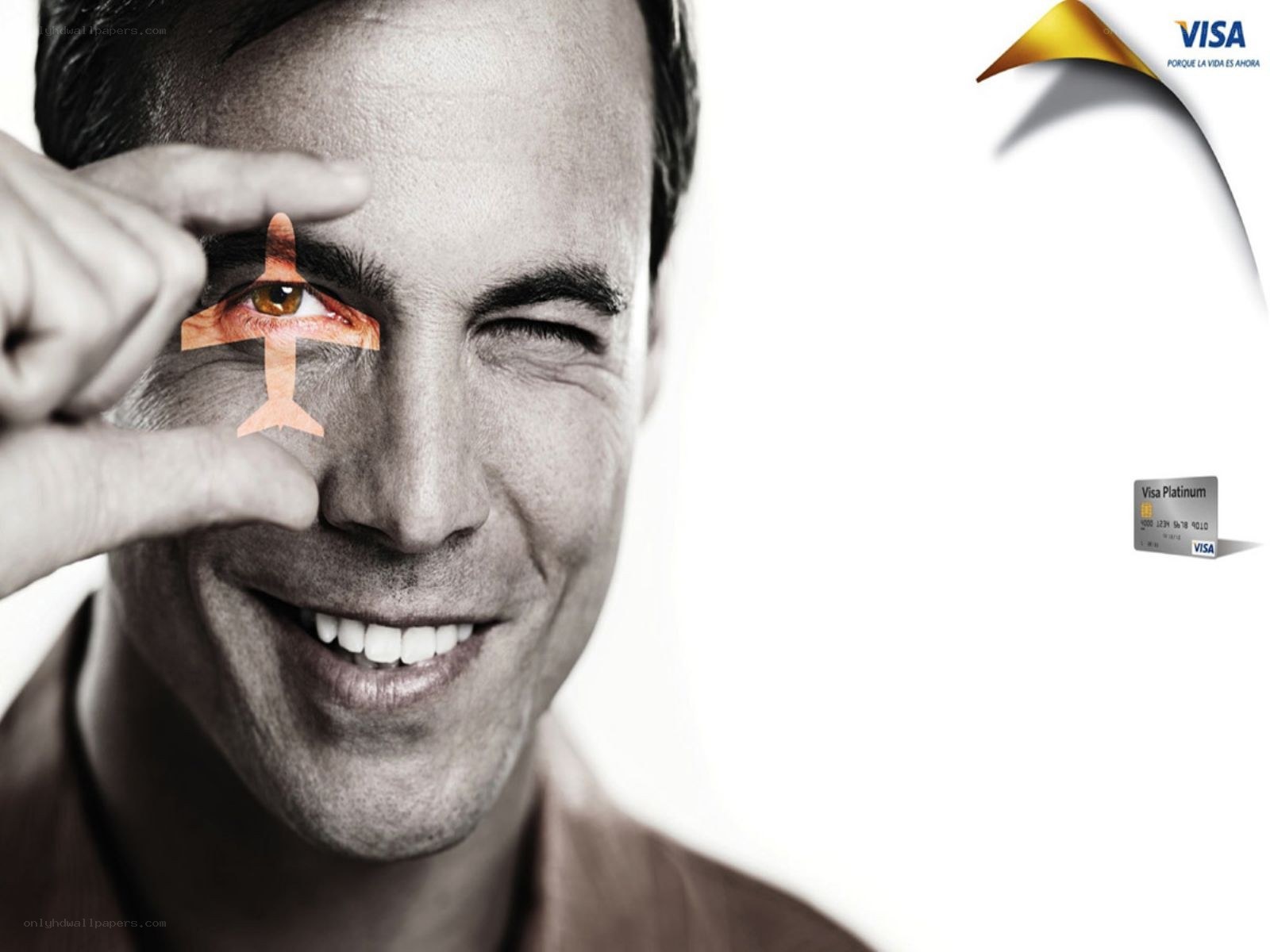 man holding airplane over eye
