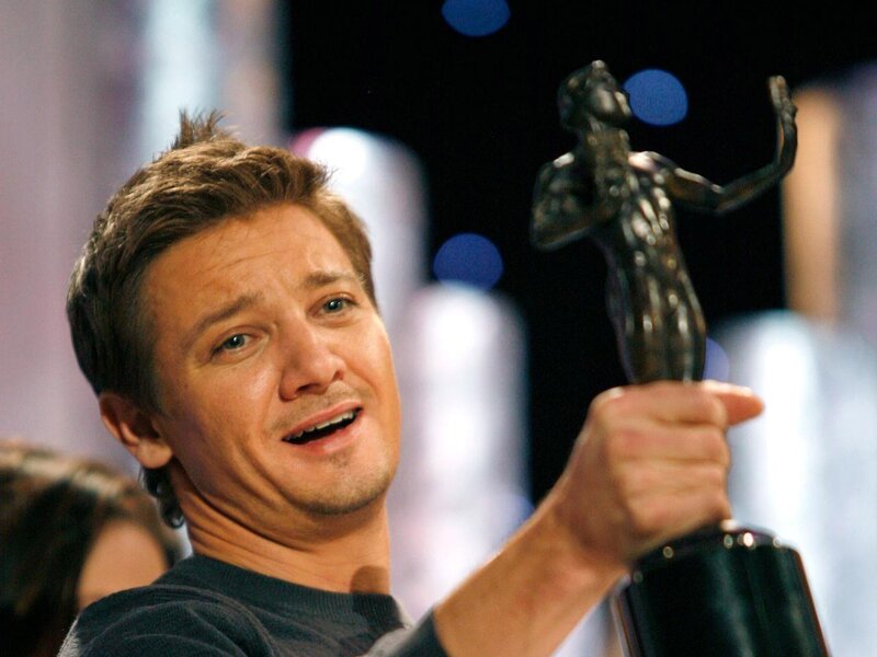 Man Holding Award — Black, Celebratory, Photograph, Crowd