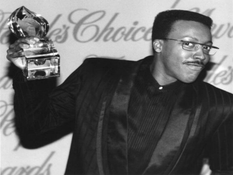 Man Holding Award — Black, Celebratory, Photograph