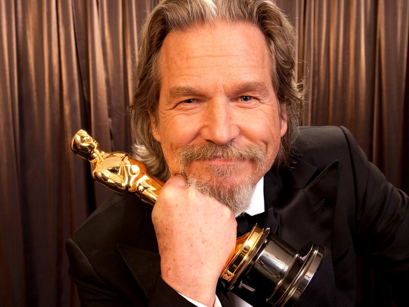 Man Holding Award — Black, Celebratory, Photograph, Tuxedo