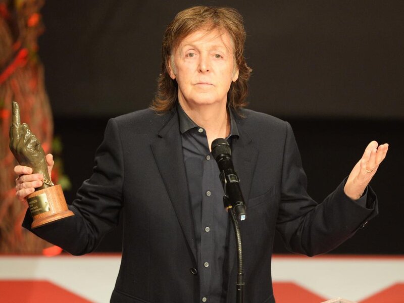 Man Holding Award — Black, Formal, Photograph, Microphone