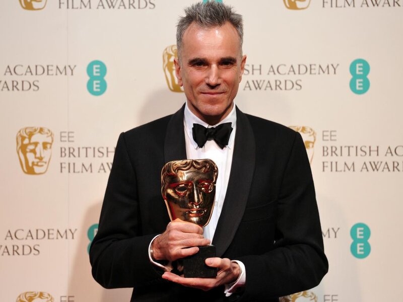 Man Holding Award — Black, Formal, Photograph