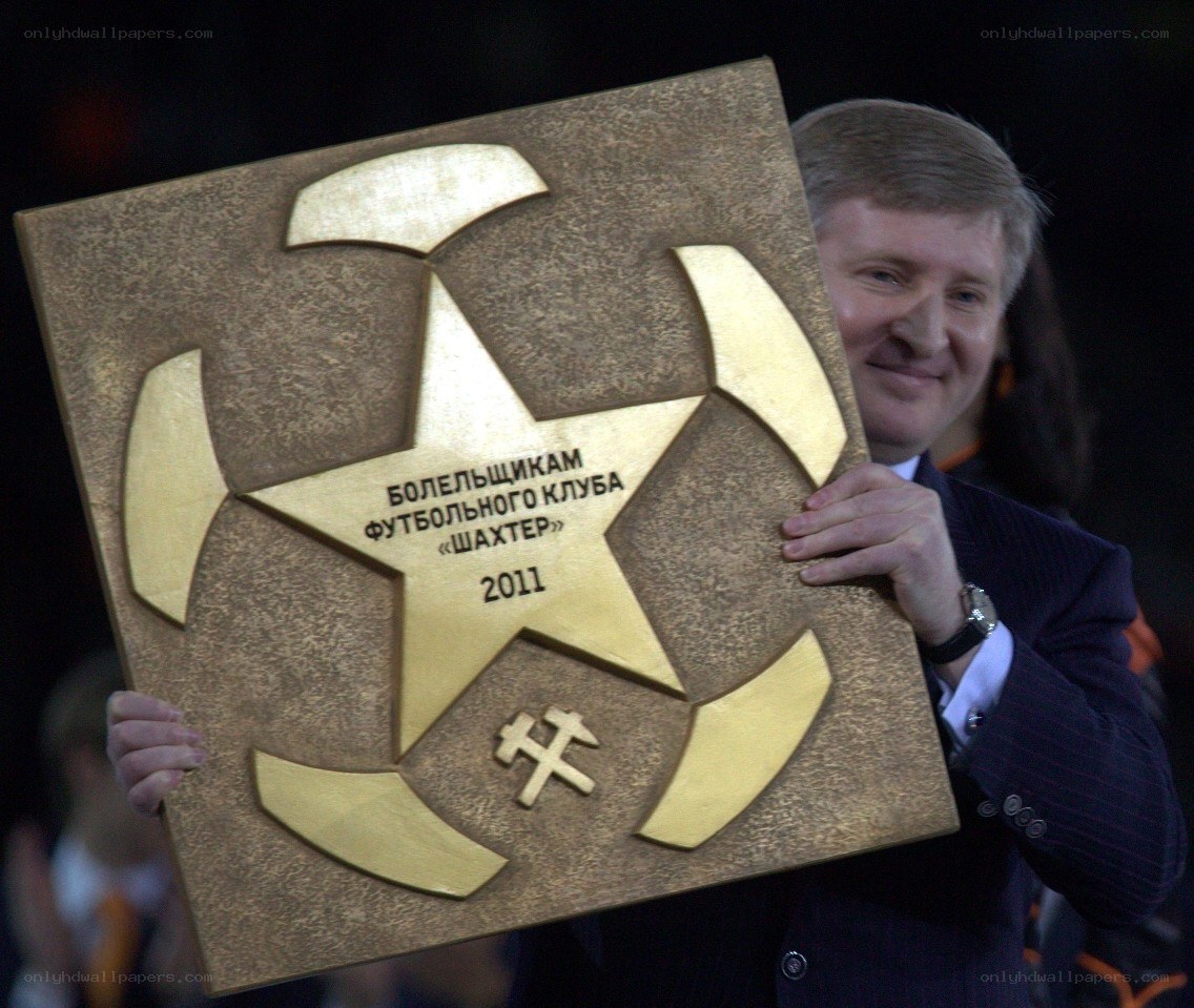 man holding award plaque