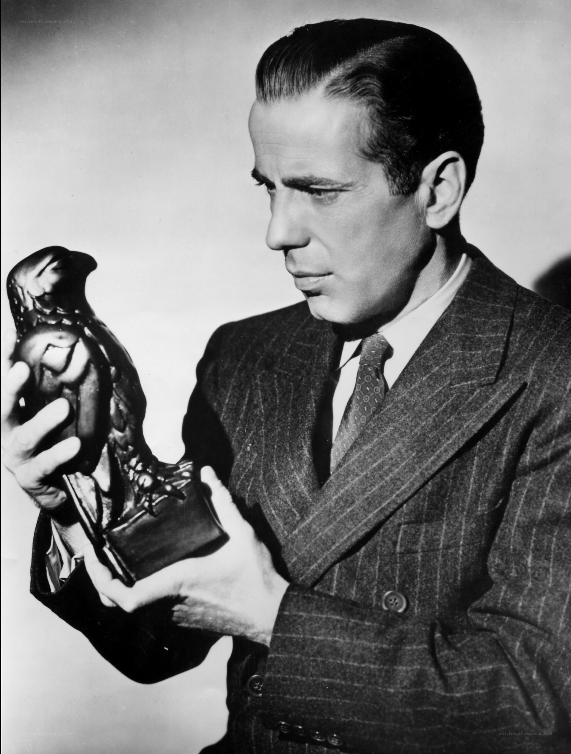 man holding award statue