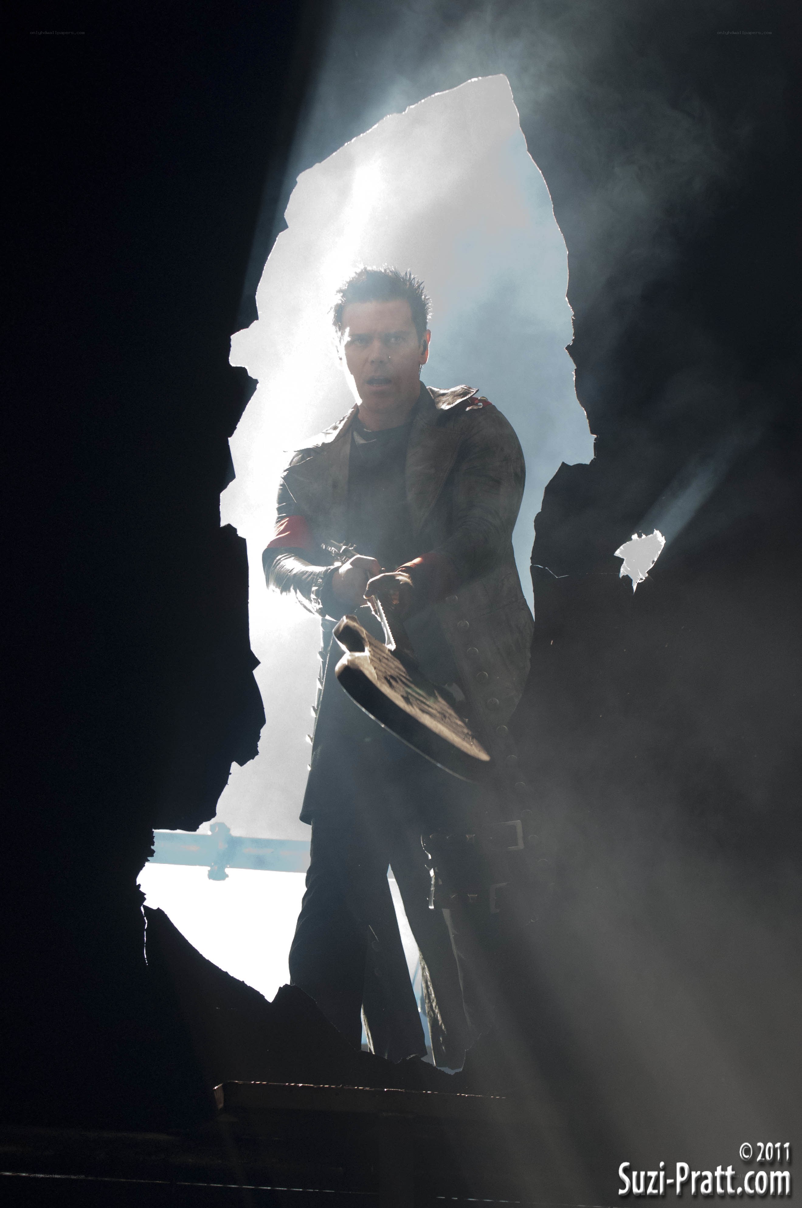 man holding axe in dark room