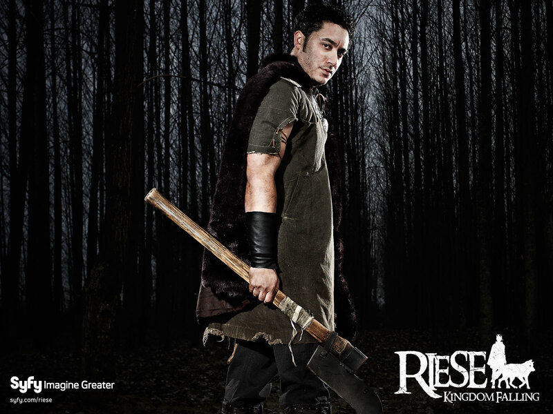 Man Holding Axe in Forest